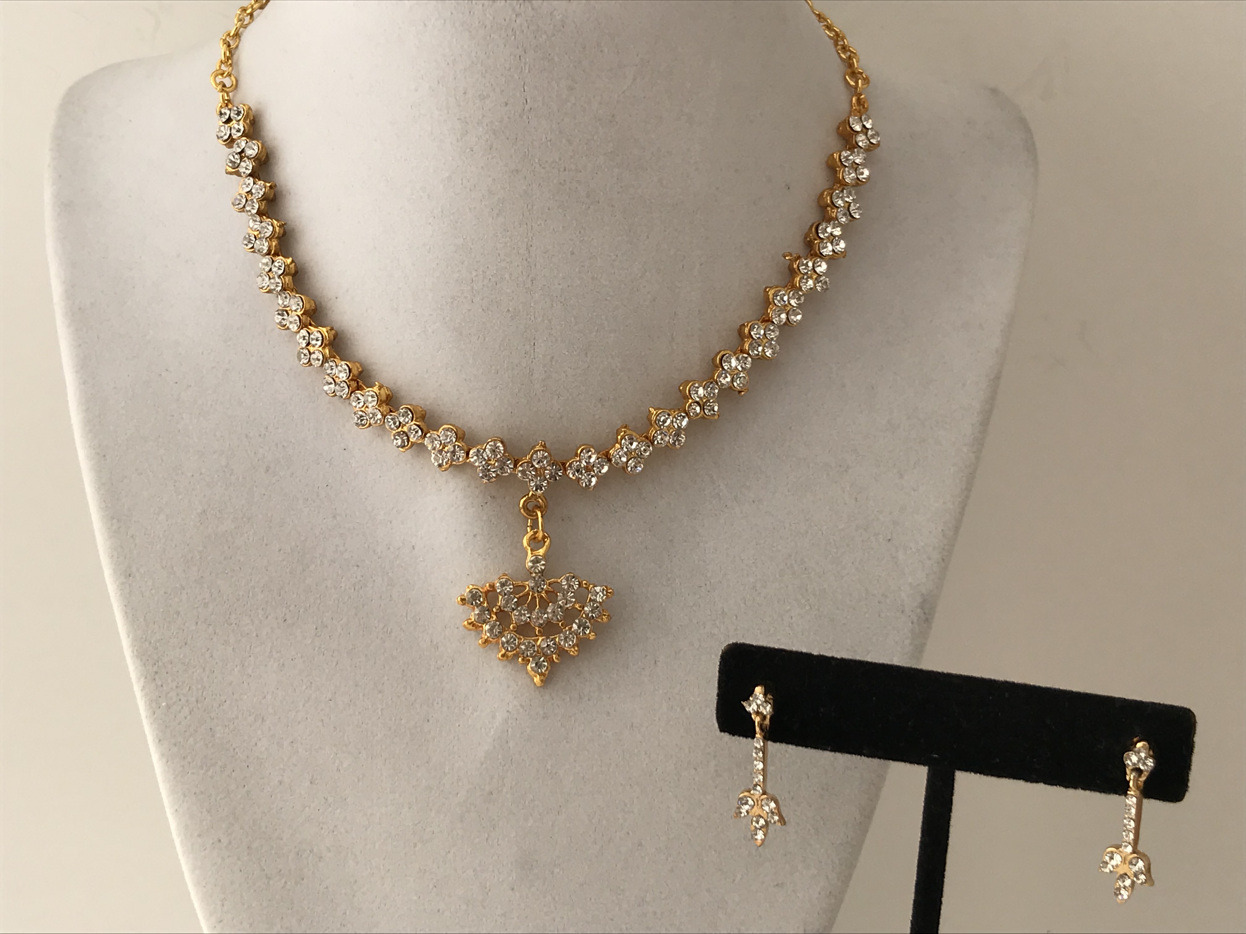 White stone discount pendants in gold